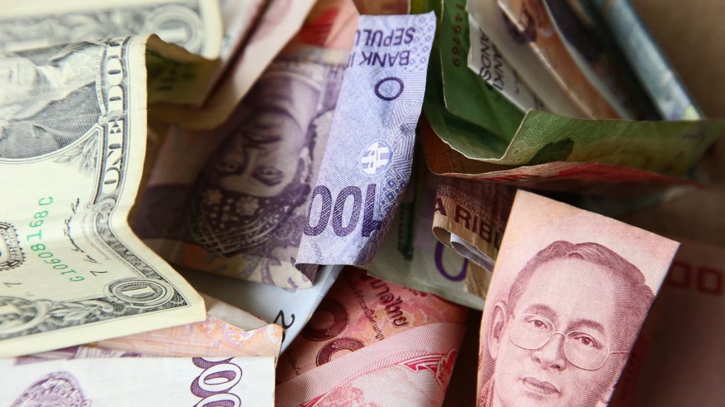 Discover how Asia FX weakens as the dollar rebounds, driving focus on global rate cuts and their economic implications